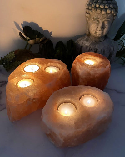 3 variations of Himalayan Salt Candle Holders with lit votives