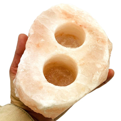 2 hole Himalayan Salt Candle Holder in a hand for size reference