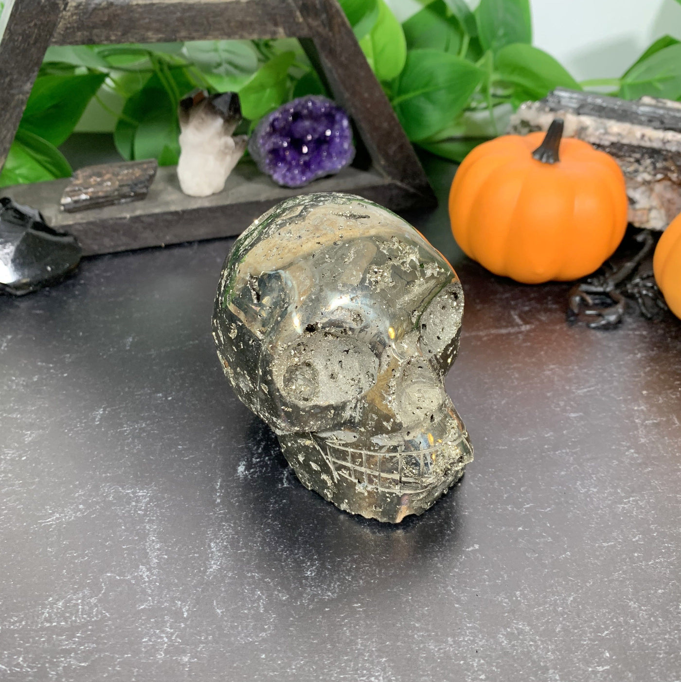 angled shot of Pyrite Skull with decorations in the background