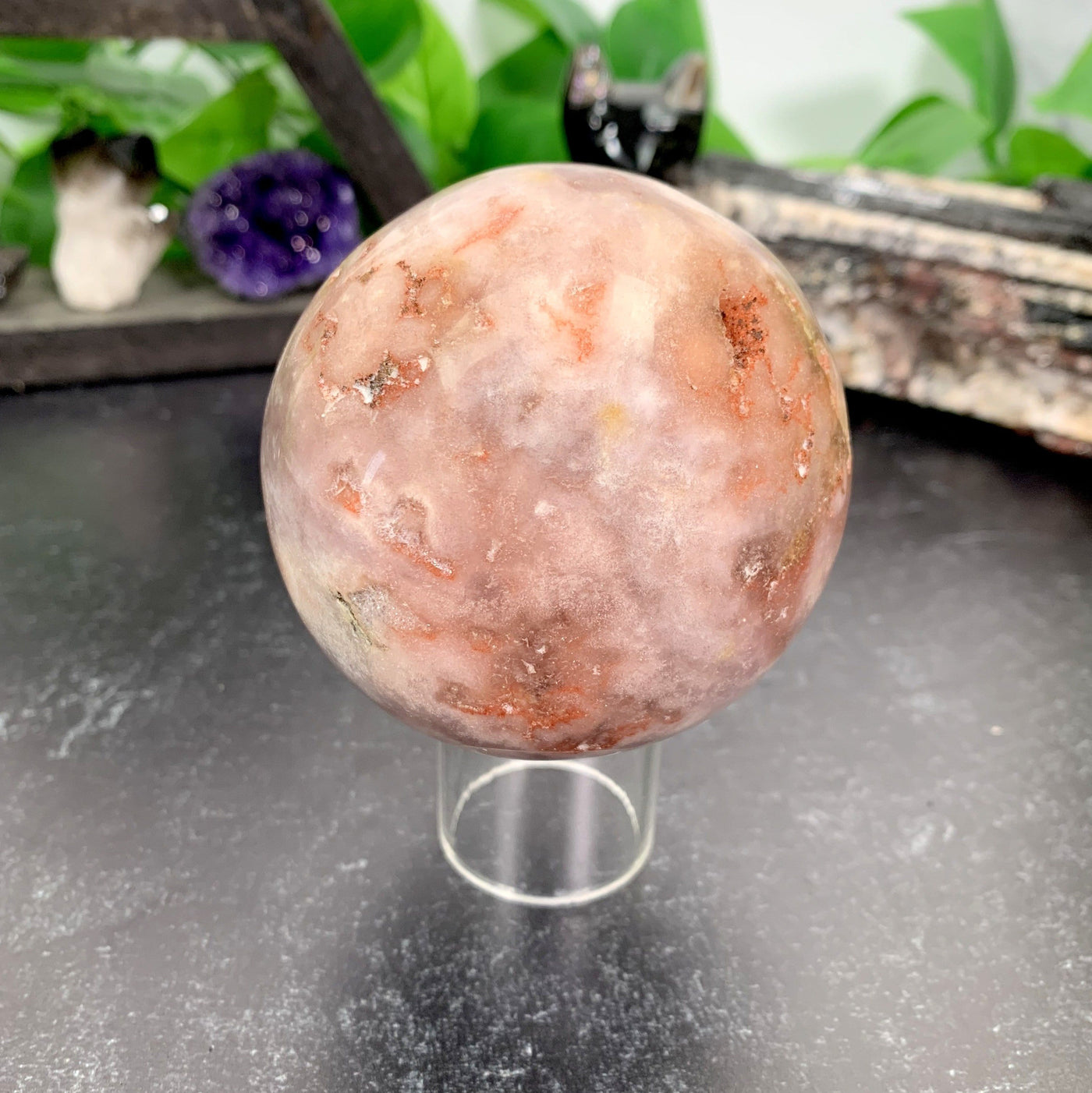 Pink Amethyst Druzy Sphere with decorations in the background
