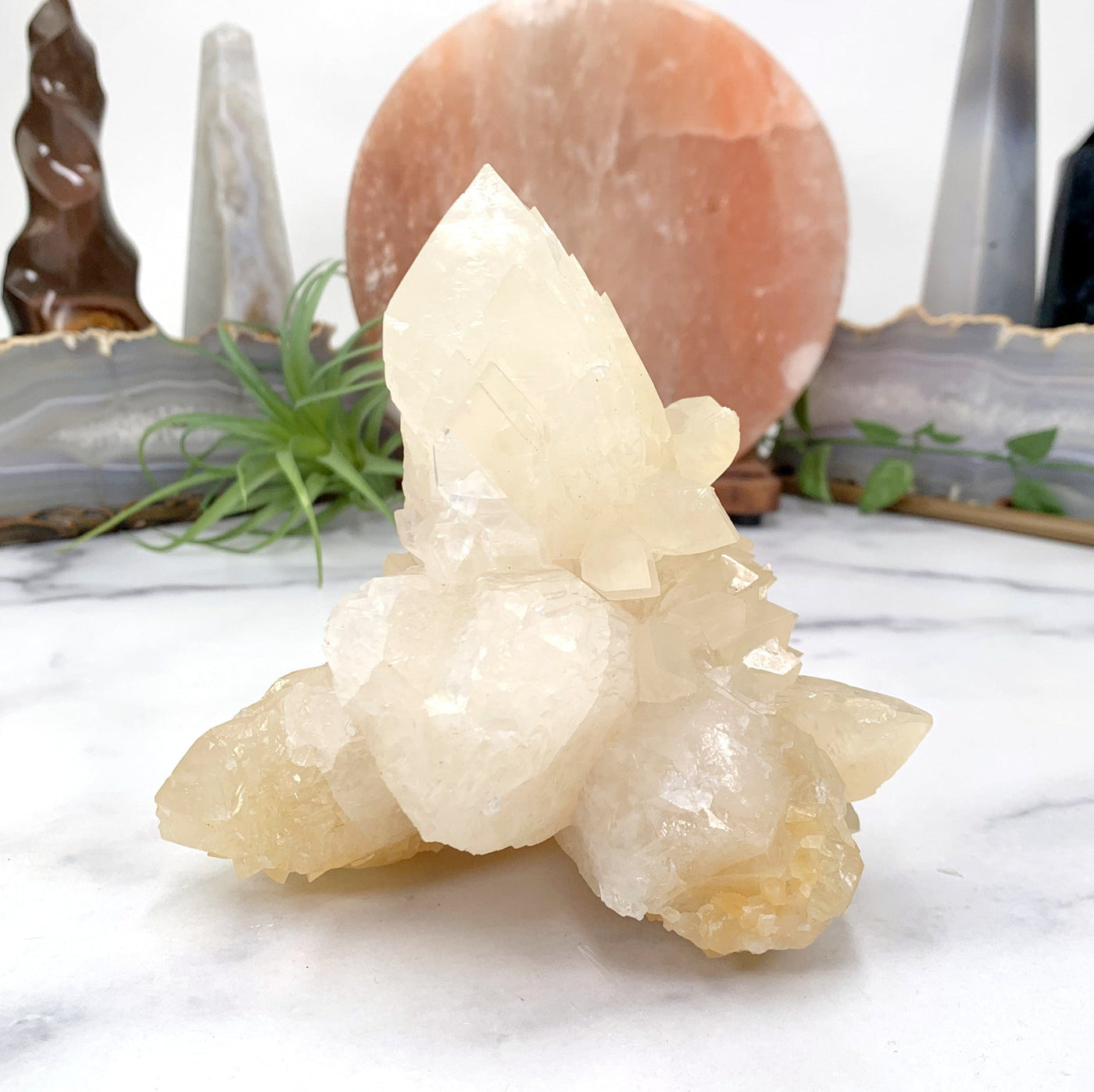 side view of calcite cluster on marble background