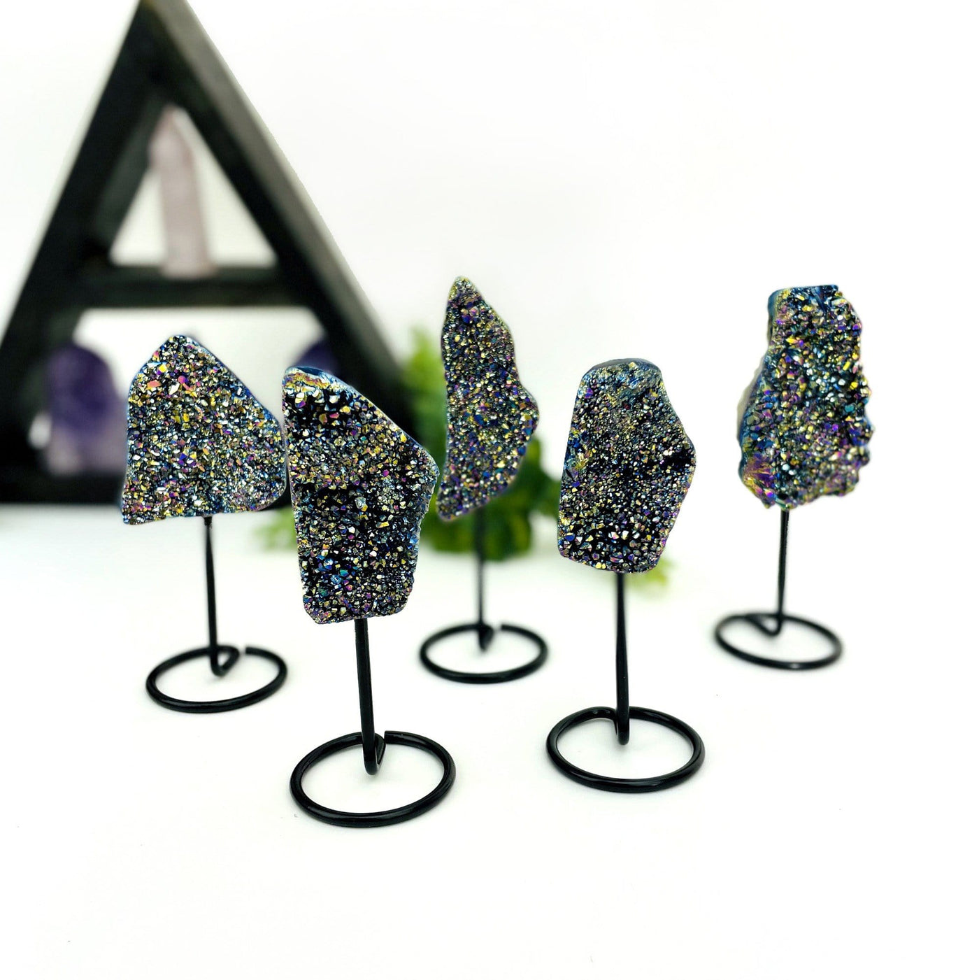 multiple titanium druzy clusters displayed to show the differences in the sizes 