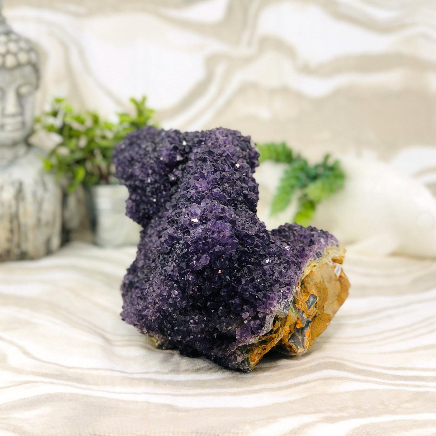 Amethyst Cluster Stalactite with decorations in the background