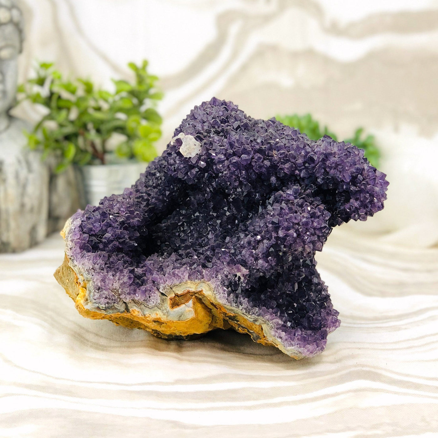 Amethyst Cluster Stalactite with decorations in the background