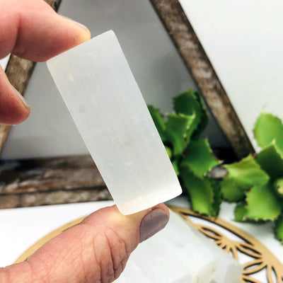 selenite rectangle bar in hand for size reference 
