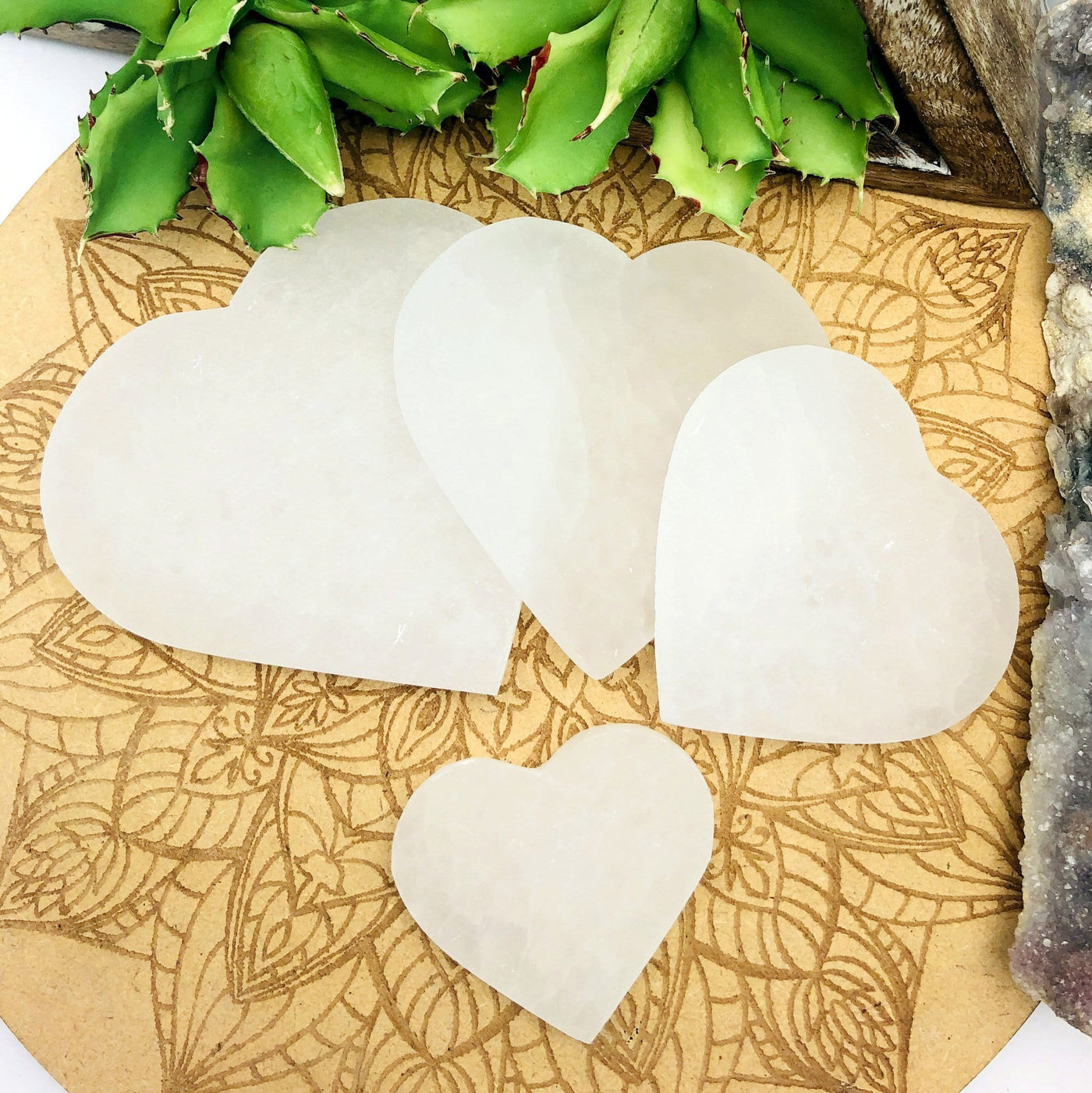 all selenite flat heart sizes on display for size comparison