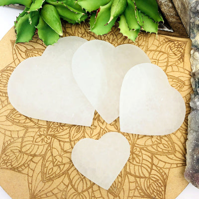 all selenite flat heart sizes on display for size comparison