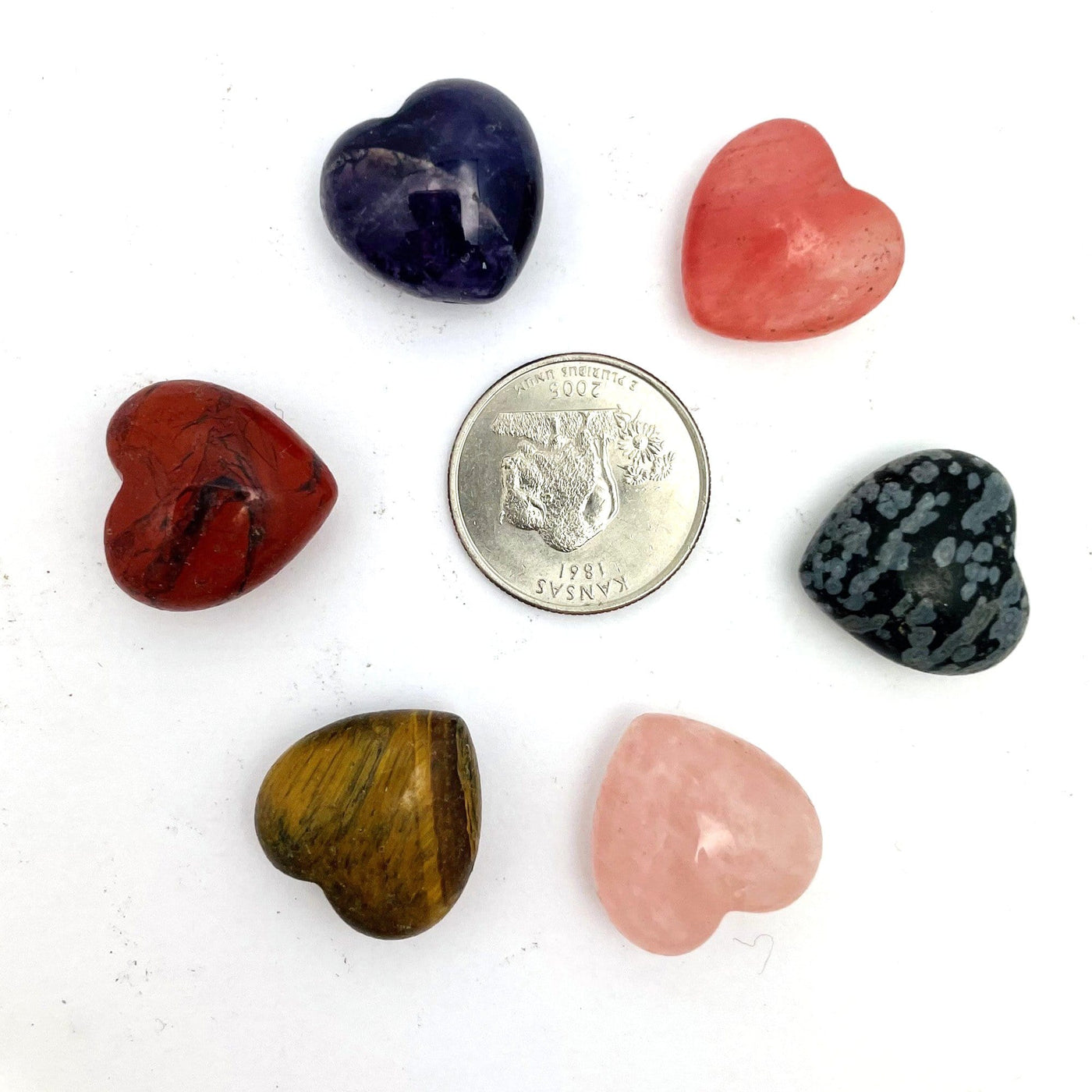Stone hearts in all the available sgtones, tigers eye, red jasper, amethyst, strawberry quartz, rose quartz, snowflake obsidian around a quarter for size reference