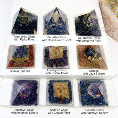 all the different orgone pyramids available with stone callouts written underneath for identifying 