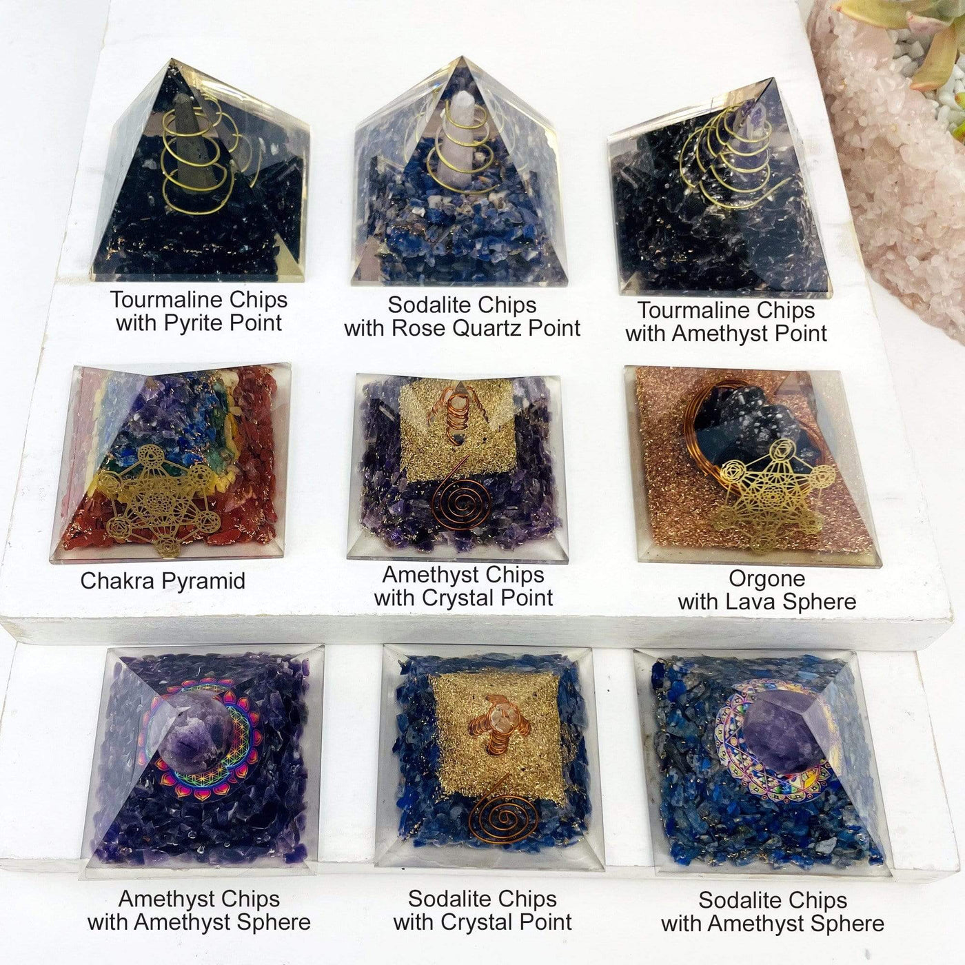 pyramids displayed to show gemstone variations in tourmaline chips with pyrite point sodalite chips with rose quartz point tourmaline chips with amethyst point chakra pyramid amethyst chips with crystal quartz point orgone with lava sphere amethyst chips with amethyst sphere sodalite chips with crystal point sodalite chips with amethyst sphere