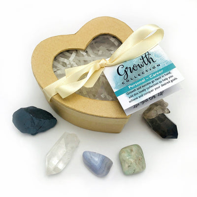 growth heart box with hematite, crystal quartz, blue lace agate, amazonite, and smoky quarts surrounding it