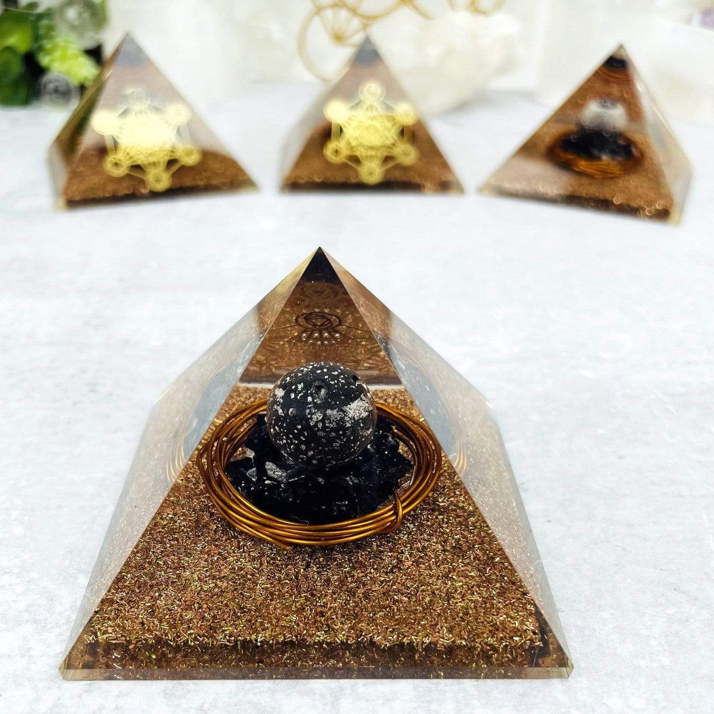 Back view of Orgone Pyramid Tourmaline Chips and Lava Sphere