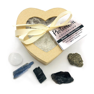 Crystal Healing Protection Set of Stones in Heart Shaped Box displayed all gemstones that are inside which are selenite blue kyanite black tourmaline black obsidian pyrite