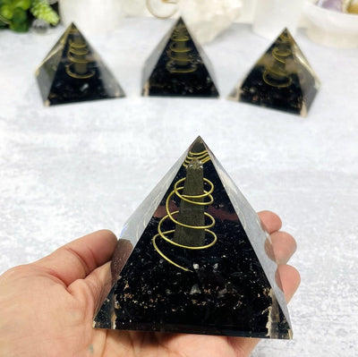 Orgone Tourmaline with Pyrite Point Pyramid in hand for size reference