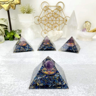 Orgone Sodalite Pyramid Amethyst Sphere and Colorful Medallion displayed on white background