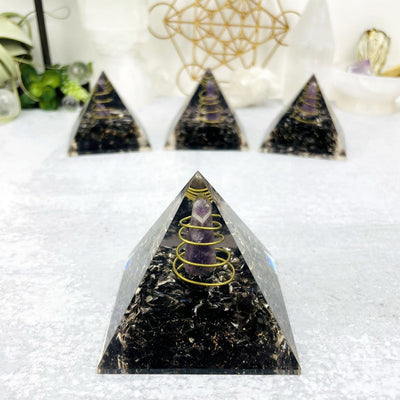 Orgone Tourmaline with Amethyst Point Pyramid displayed 