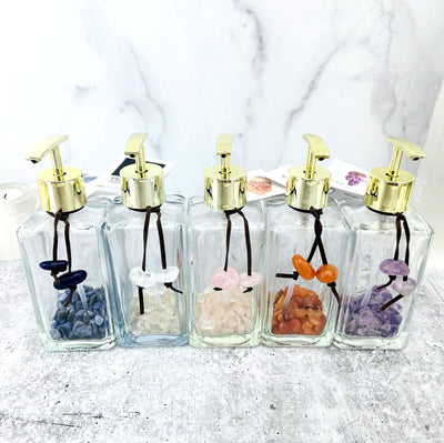 Tumbled Stone Soap Dispensers in a row, one of each stone available