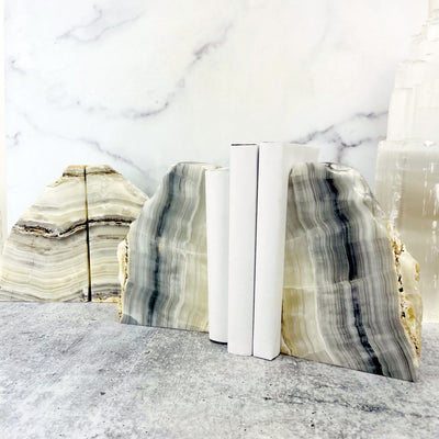 Products Onyx Bookends - one set holding books and one together