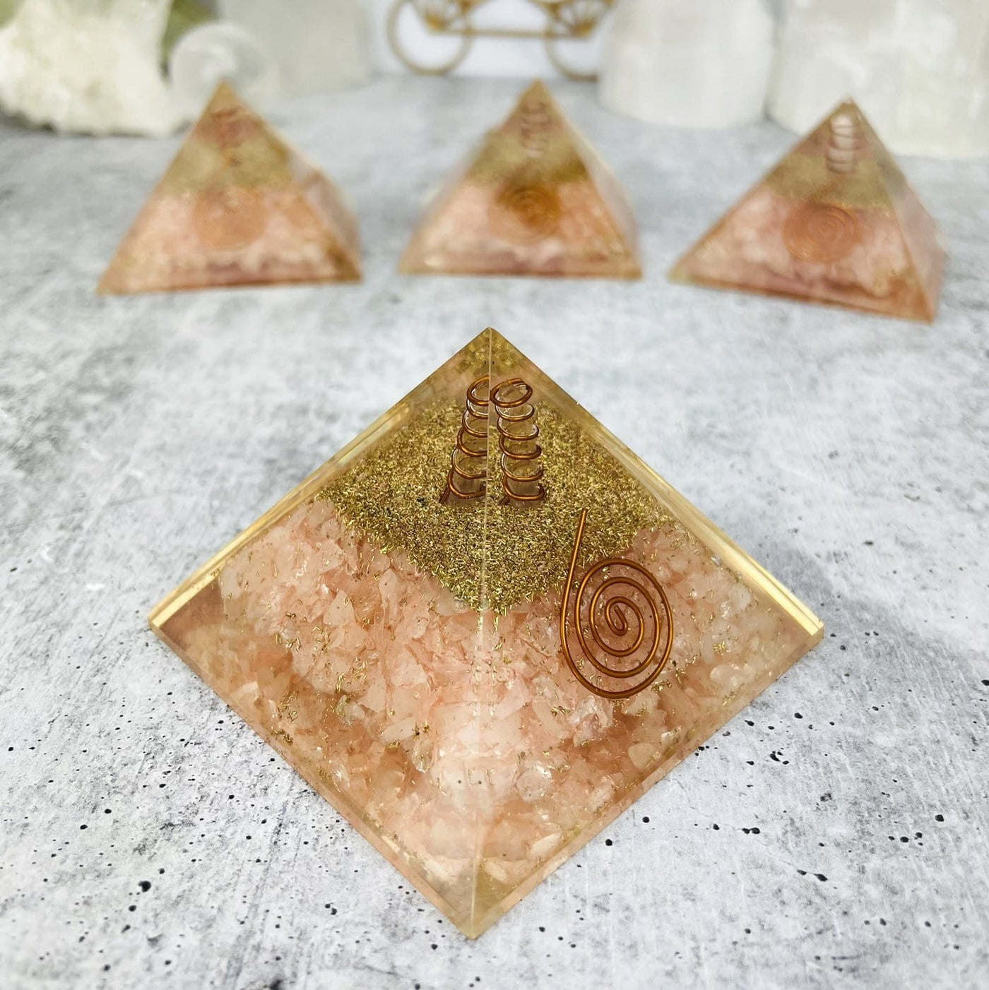 Orgone Rose Quartz with Crystal Point Pyramid displayed to show side view