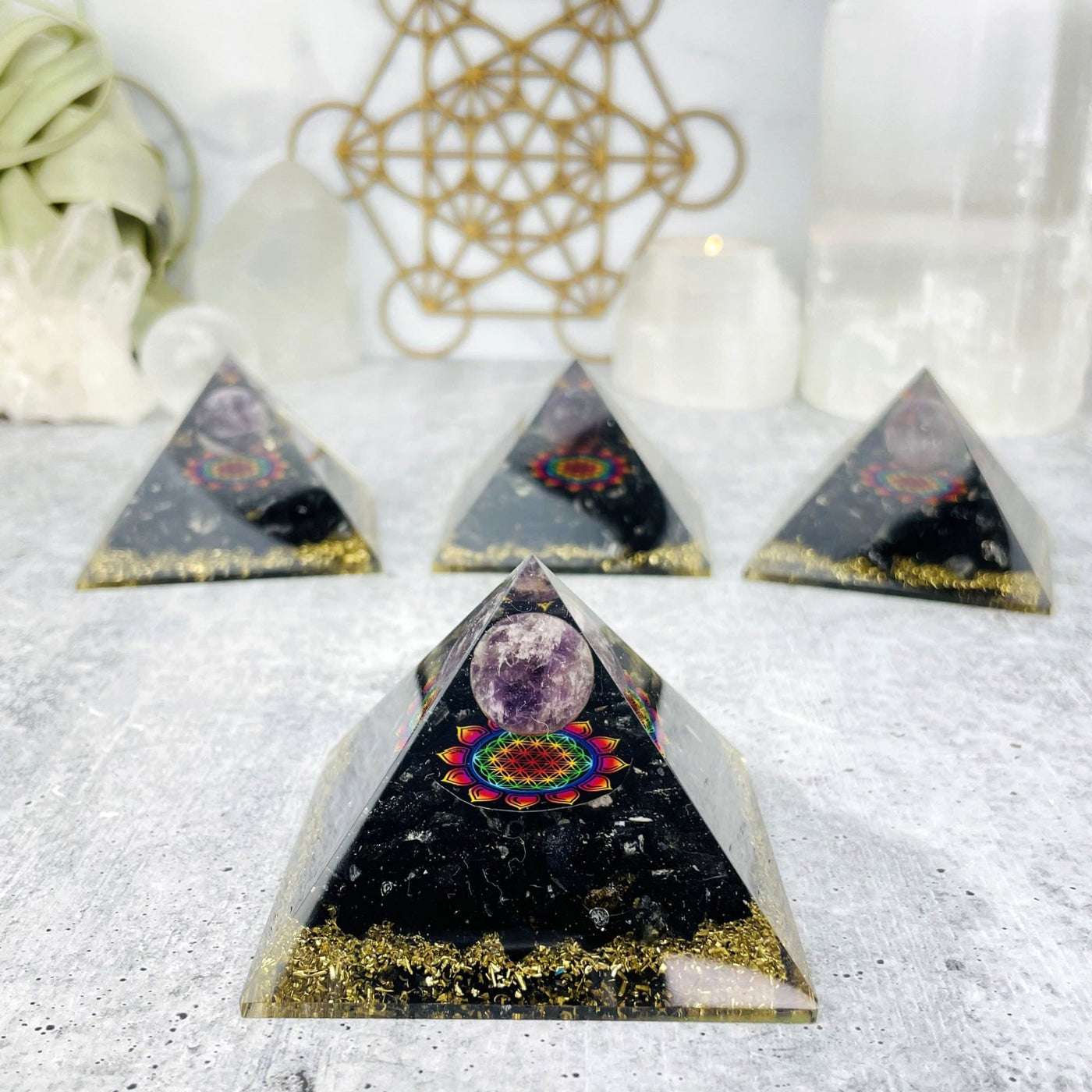 orgone pyramid with decorations in the background