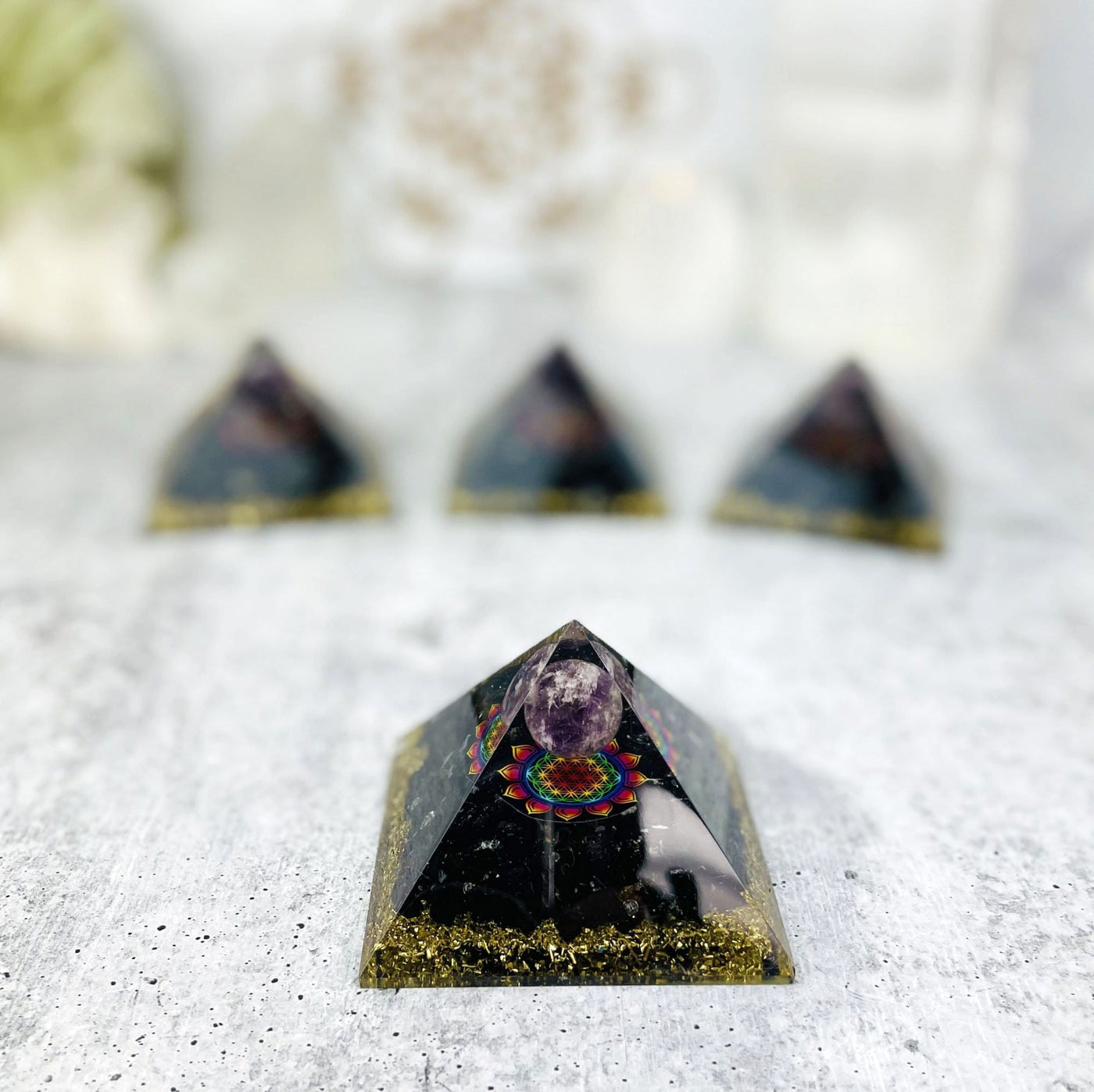 orgone pyramid with decorations in the background