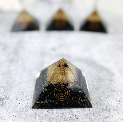 Up close of Orgone Black Tourmaline with Crystal Point Pyramid