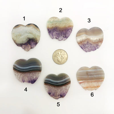 6 Amethyst Stalactite Slice Hearts surrounding a quarter for size reference