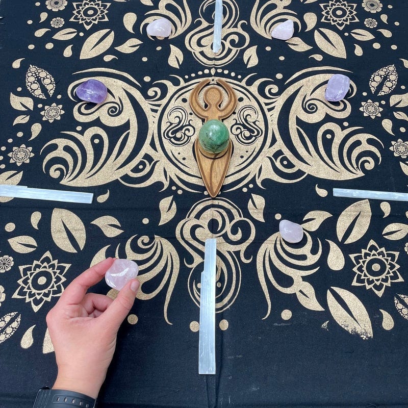 angel flower crystal grid cloth pictured with crystals on it and a hand tp show size reference