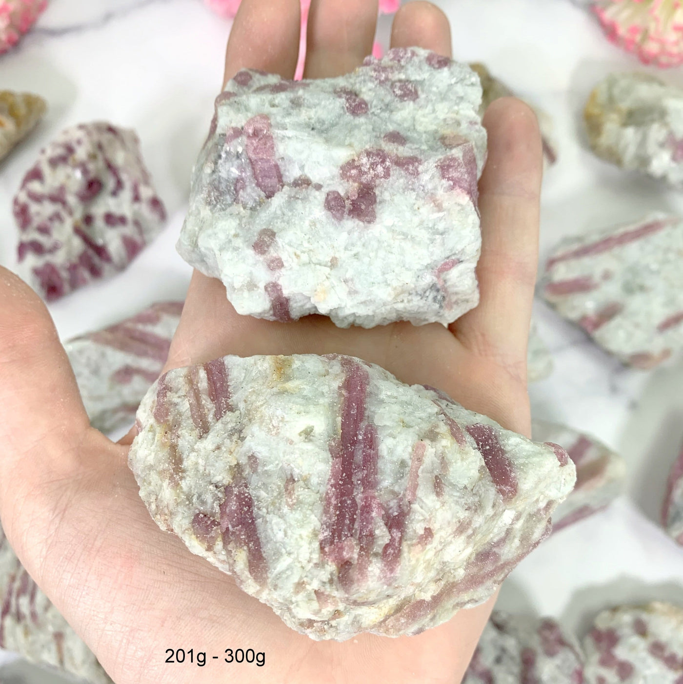 atural Pink Tourmaline with Mica on Matrix - 2 in a hand