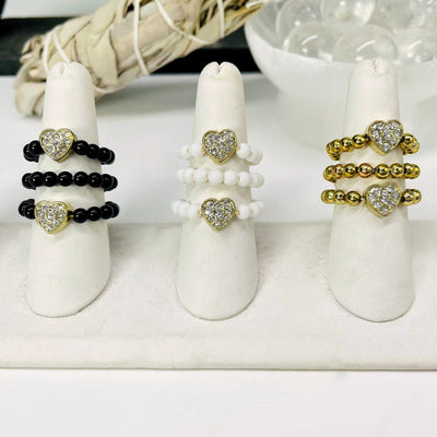 three of each heart elastic ring color options on ring display