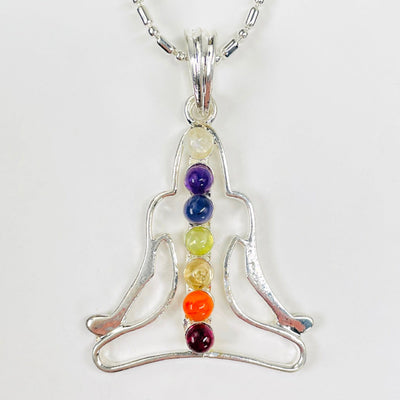 close up of one chakra buddha pendant necklace for details
