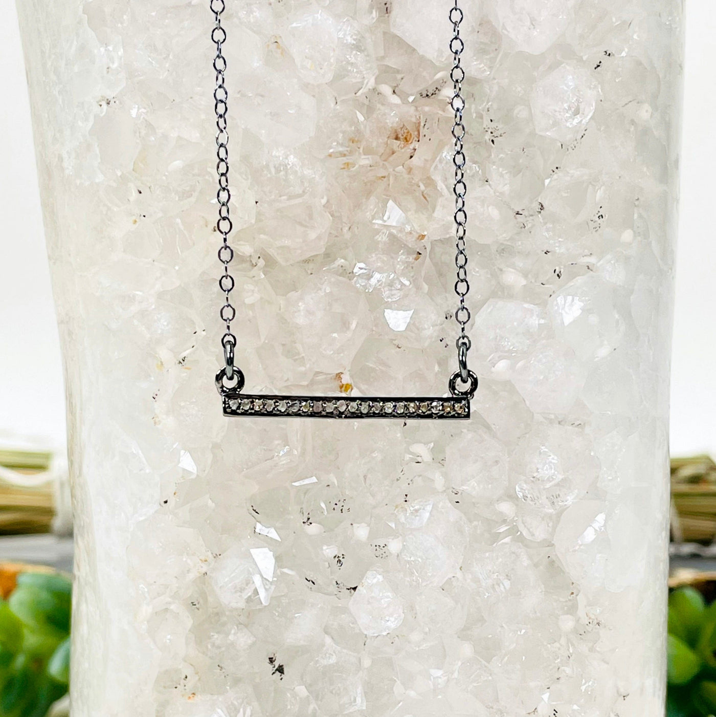 pave diamond double bail bar necklace hanging off of a druzy stone