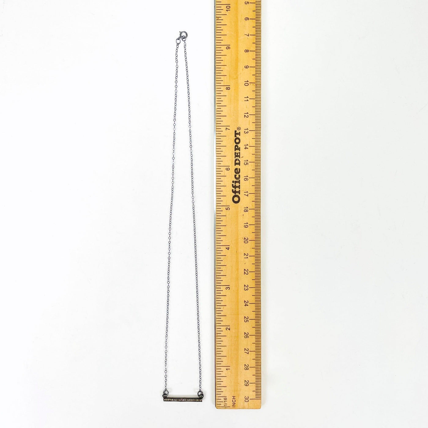 full necklace length next to a ruler for length reference
