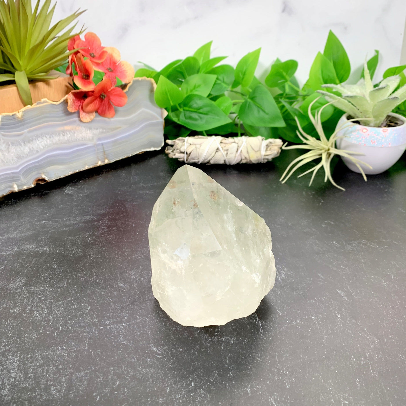 Crystal Quartz Point with decorations in the background