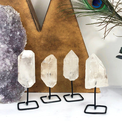 Products Natural Stone Crystal on Metal Stand - 4 lined up on a table