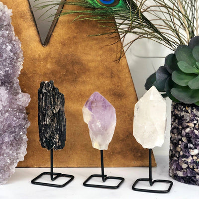 Products Natural Stone Crystal on Metal Stand - 3 on a table