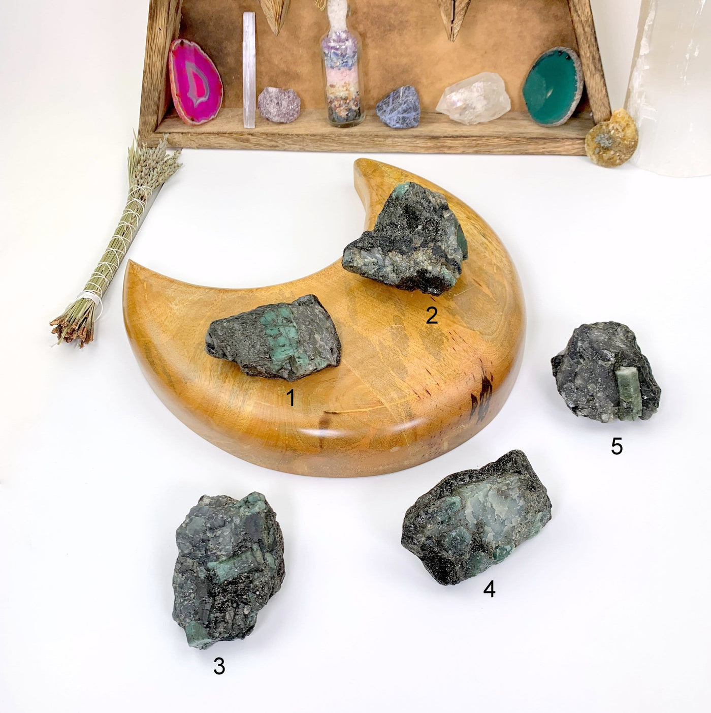 All five pieces of rough emerald labeled with a number.