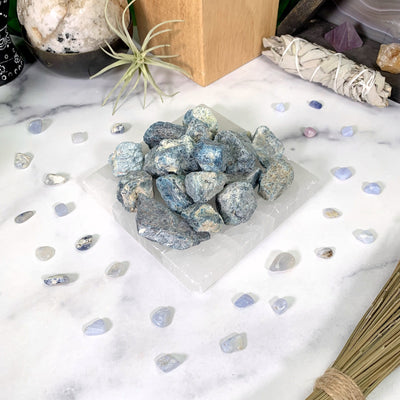 1 pound blue apatite on a marble background
