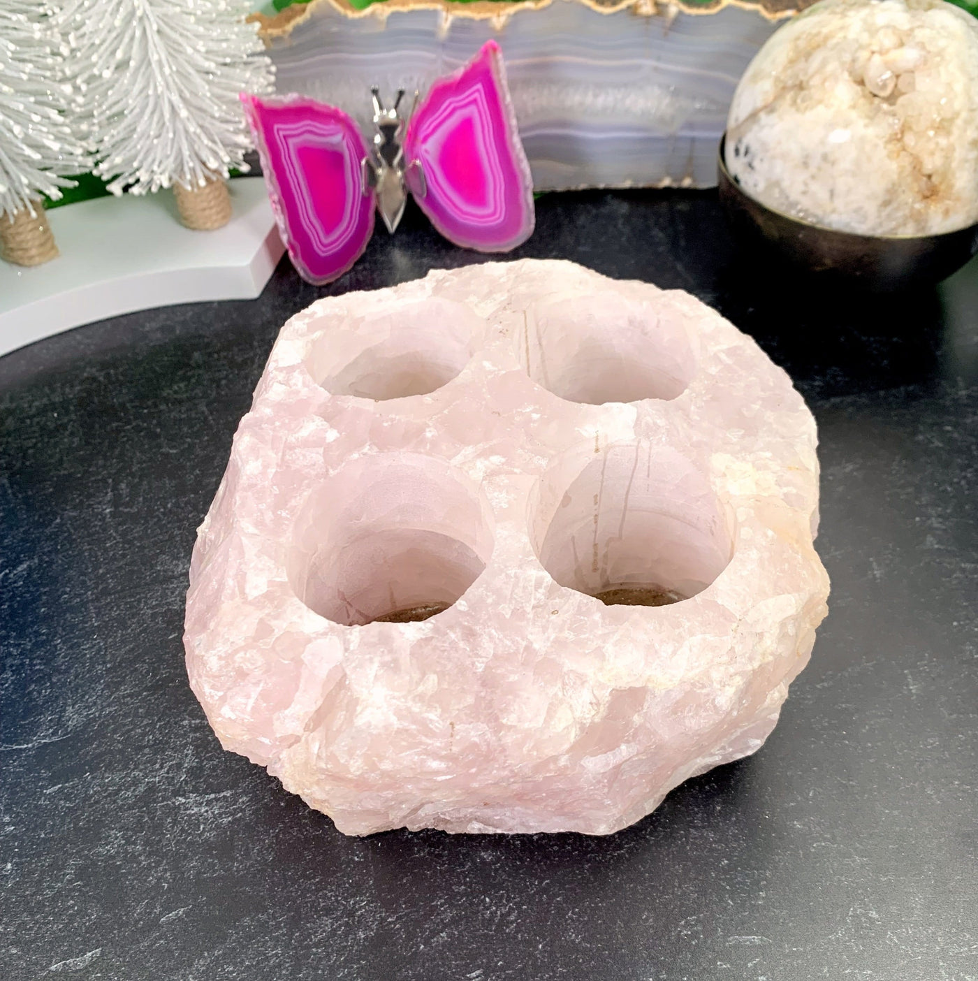 Rose Quartz Candle Holder with decorations in the background