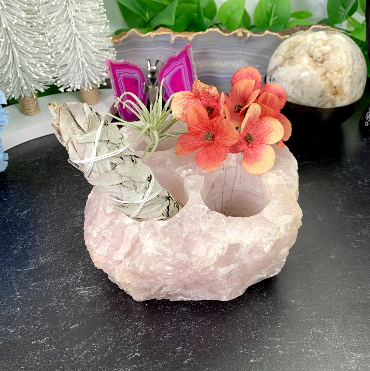 Rose Quartz Candle Holder with different items put into each votive with decorations in the background