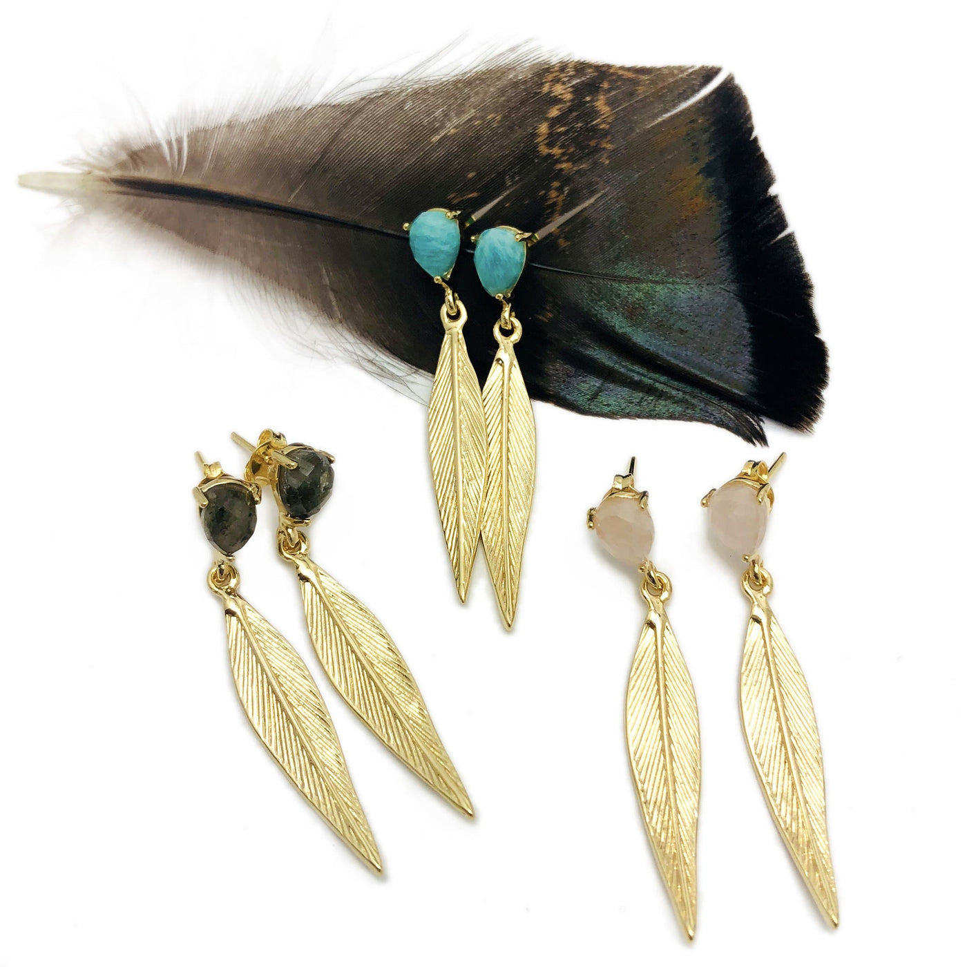 Feather Dangle Earring with Stone Stud on white background.