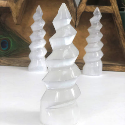 close up of selenite spiral towers for details with others in background