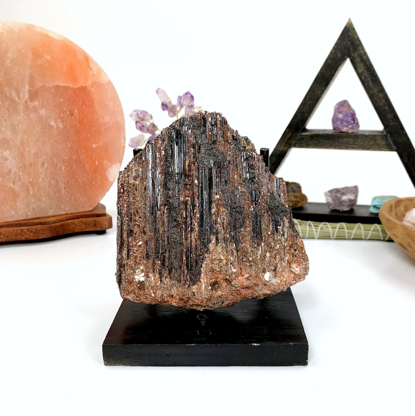 Black Tourmaline with Mica with decorations in the background