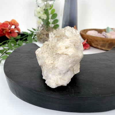 Crystal Quartz Cluster with decorations in the background