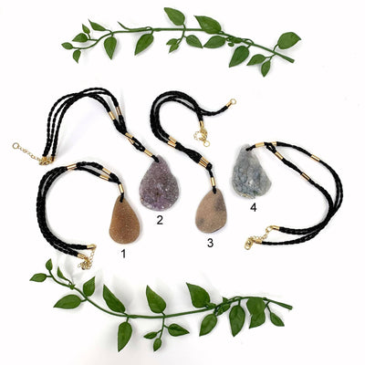 4 Druzy Teardrop Shaped Necklaces on white background