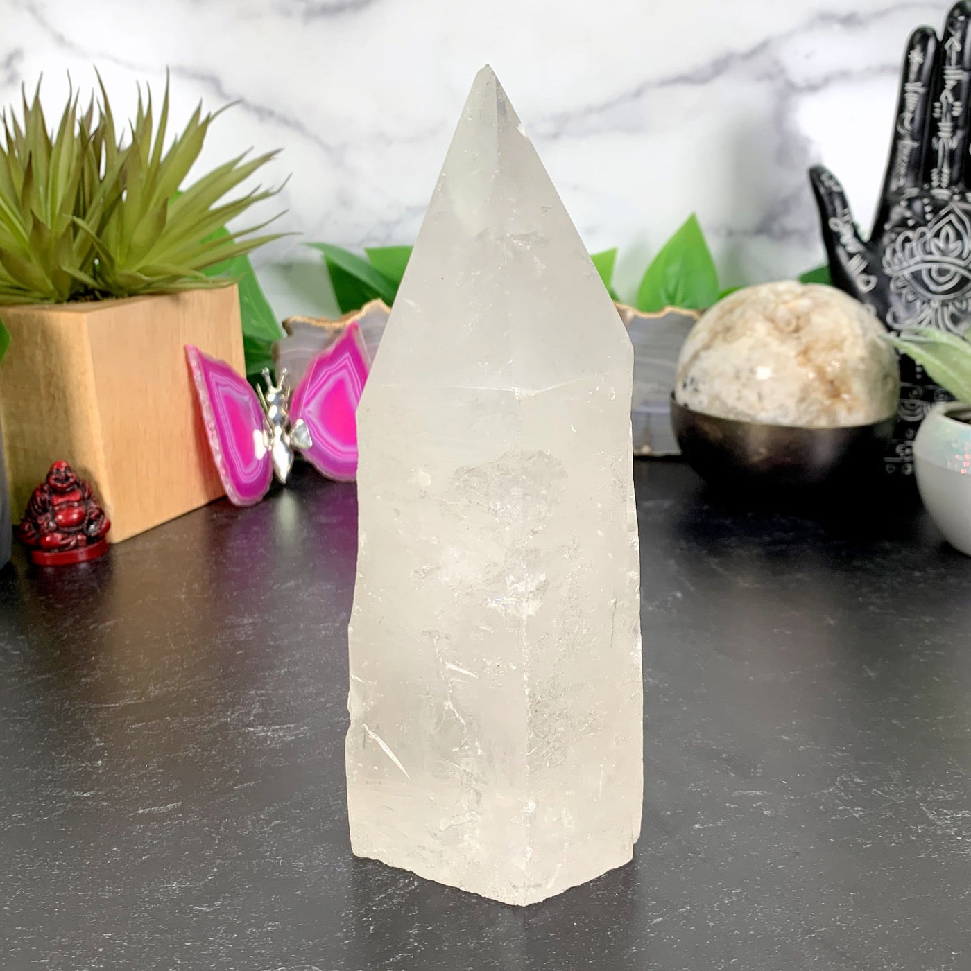 Quartz Point With Crystal Growth with decorations in the background