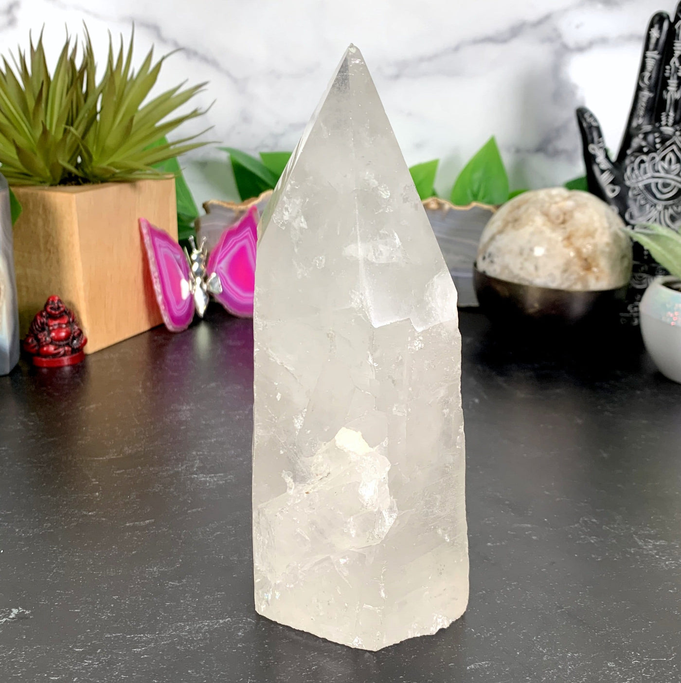 Quartz Point With Crystal Growth with decorations in the background