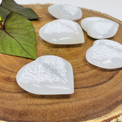 Selenite Stone Heart - Selenite Hearts with Angel Wing Engraving viewed from the side to show thickness