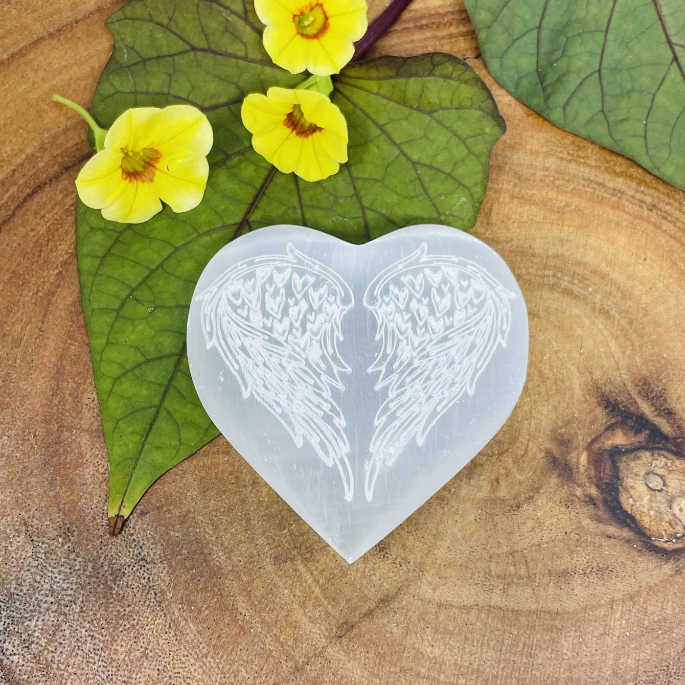 Selenite Stone Heart - Selenite Heart with Angel Wing Engraving on a wood plate