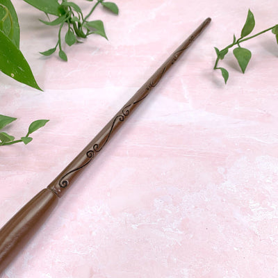 up close shot of tip of White Geode - Enchantment Wand on pink background